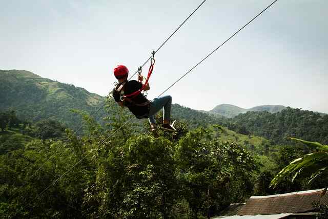 A brave person zip-lining.
