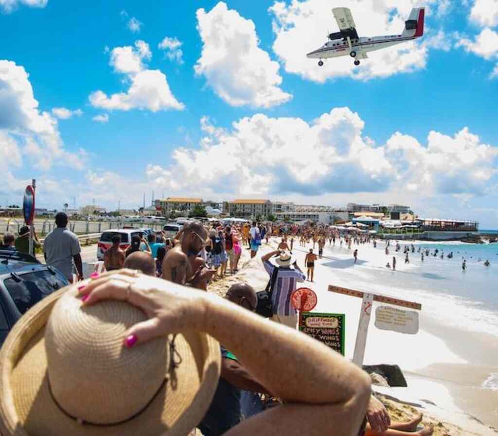 People watching the planes land on Maho Beach, in St. Maarten.