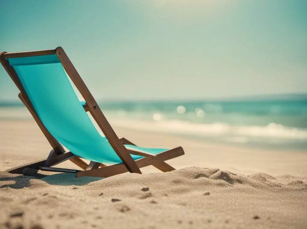 A blue beach chair on the beach sand.